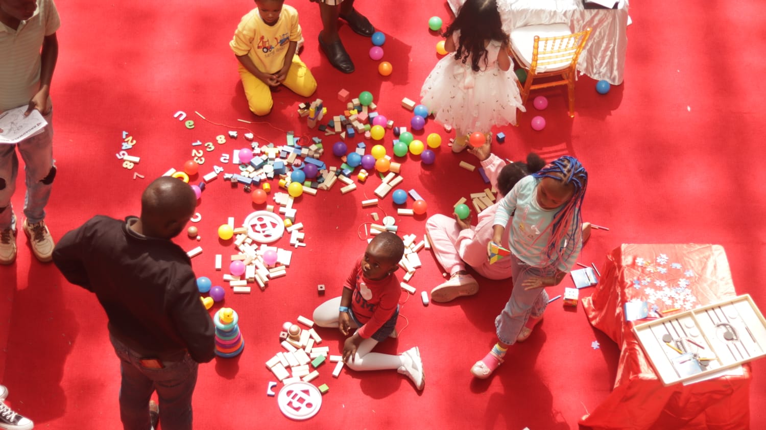 Kids enjoying ride-on cars